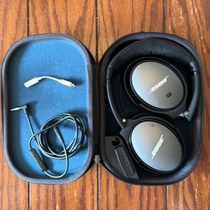 Bose Noise Cancelling Headphones. Comes with case, cord, and adapter